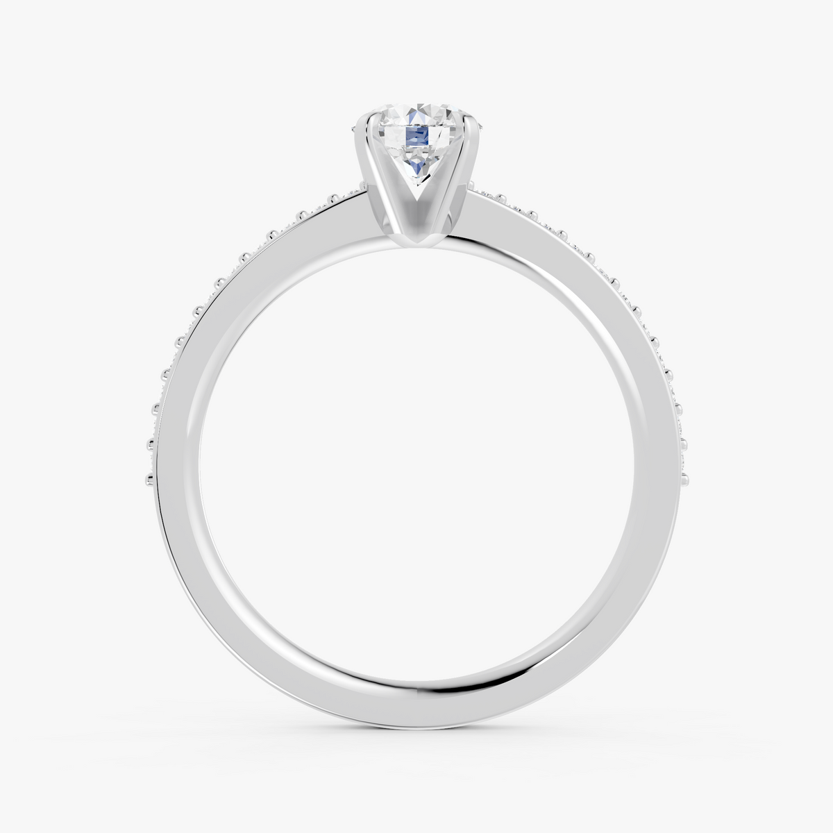 Amélie pavé forlovelsesring med rund diamant i hvitt gull, stående sett forfra