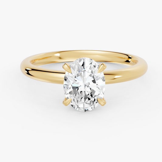 Aurora solitaire forlovelsesring med oval diamant i gult gull, liggende sett forfra