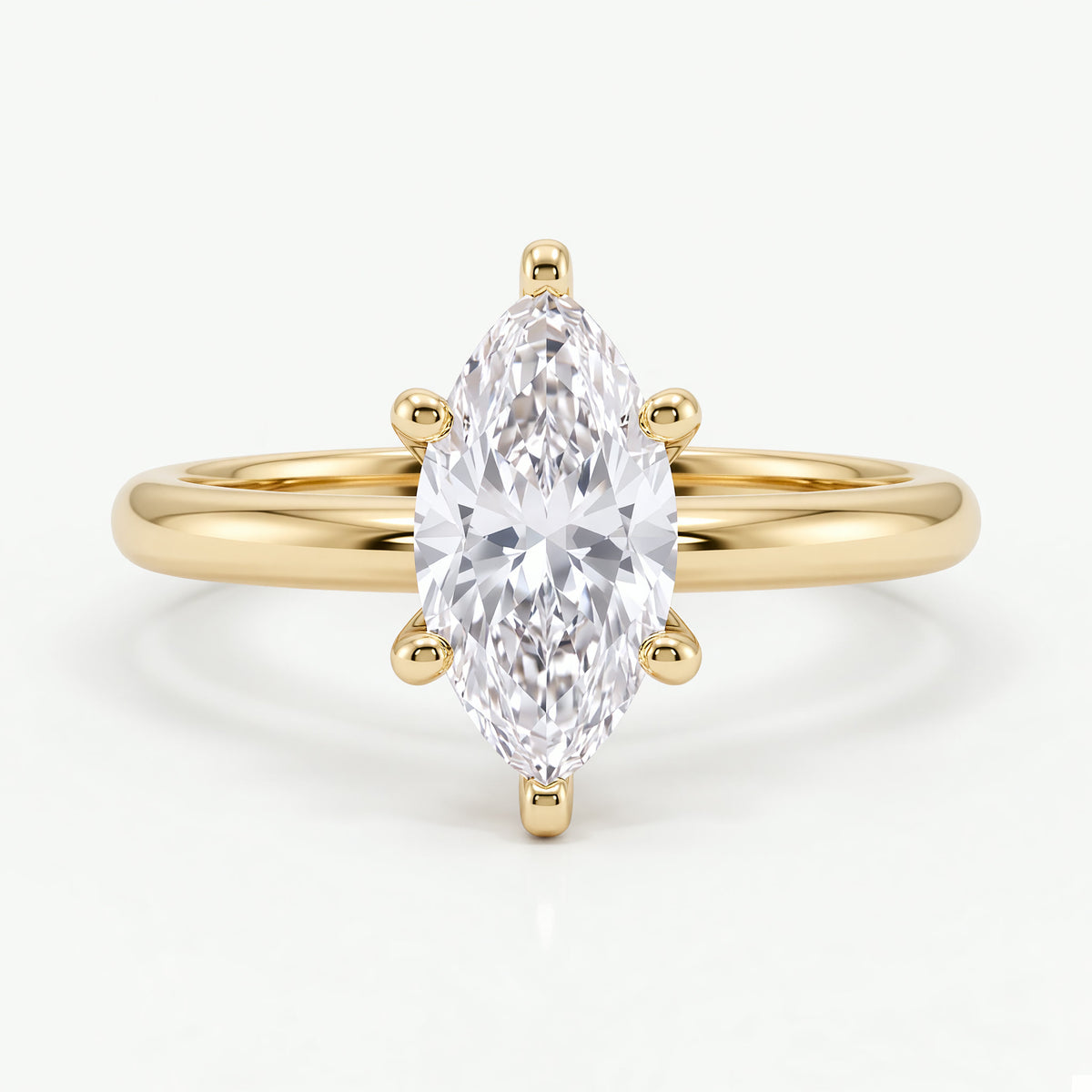 Colette solitaire forlovelsesring med marquise diamant i gult gull