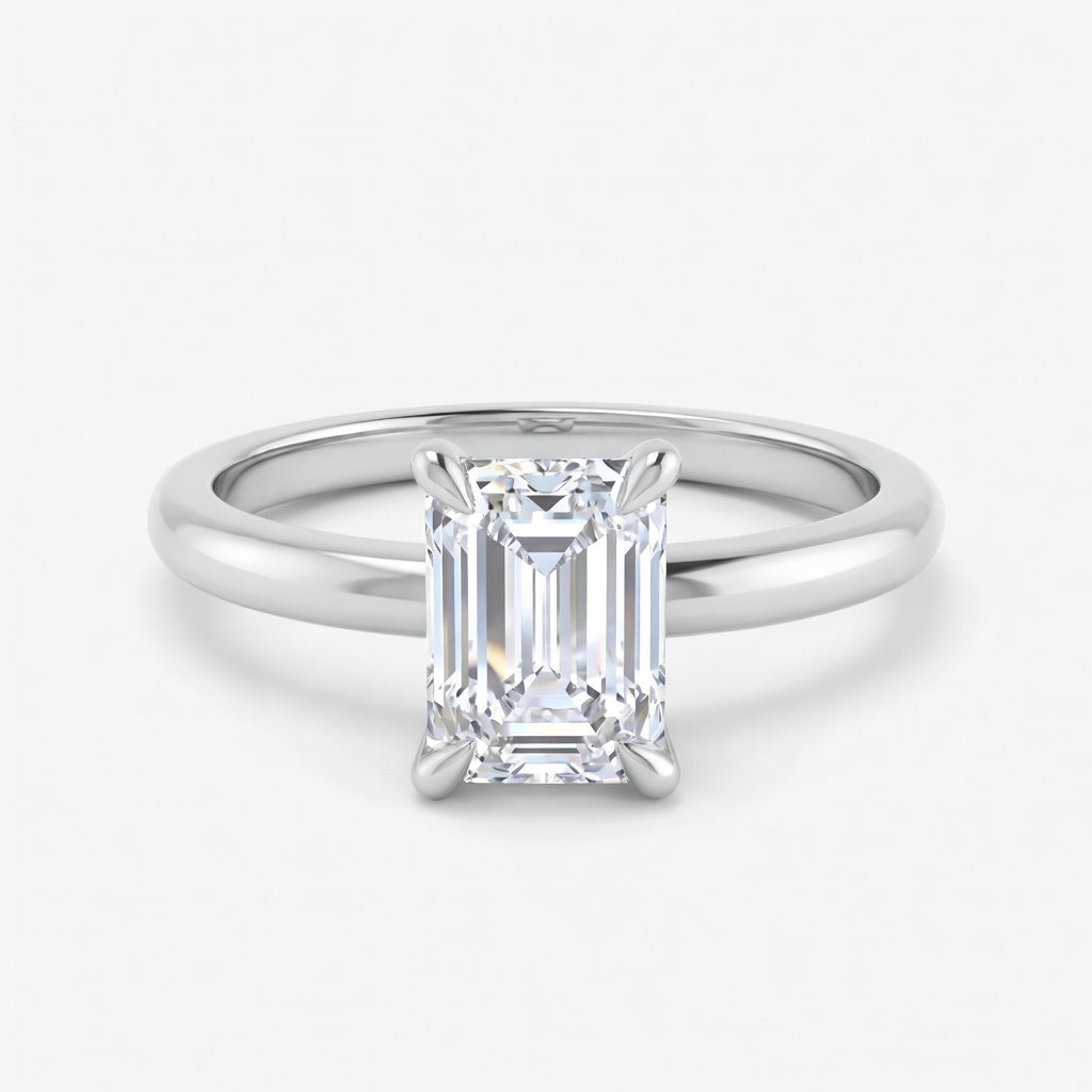 Elara solitaire forlovelsesring med emerald cut diamant i hvitt gull