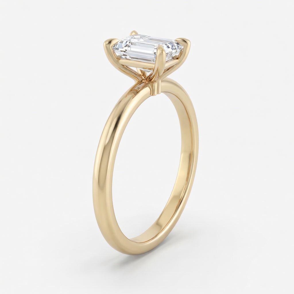 Elara solitaire forlovelsesring med emerald cut diamant i gult gull