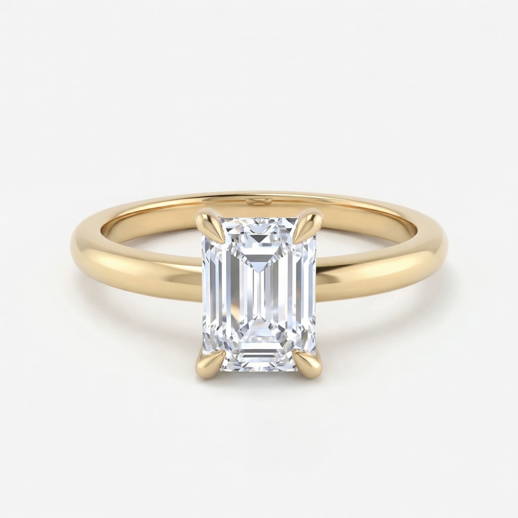 Elara solitaire forlovelsesring med emerald cut diamant i gult gull