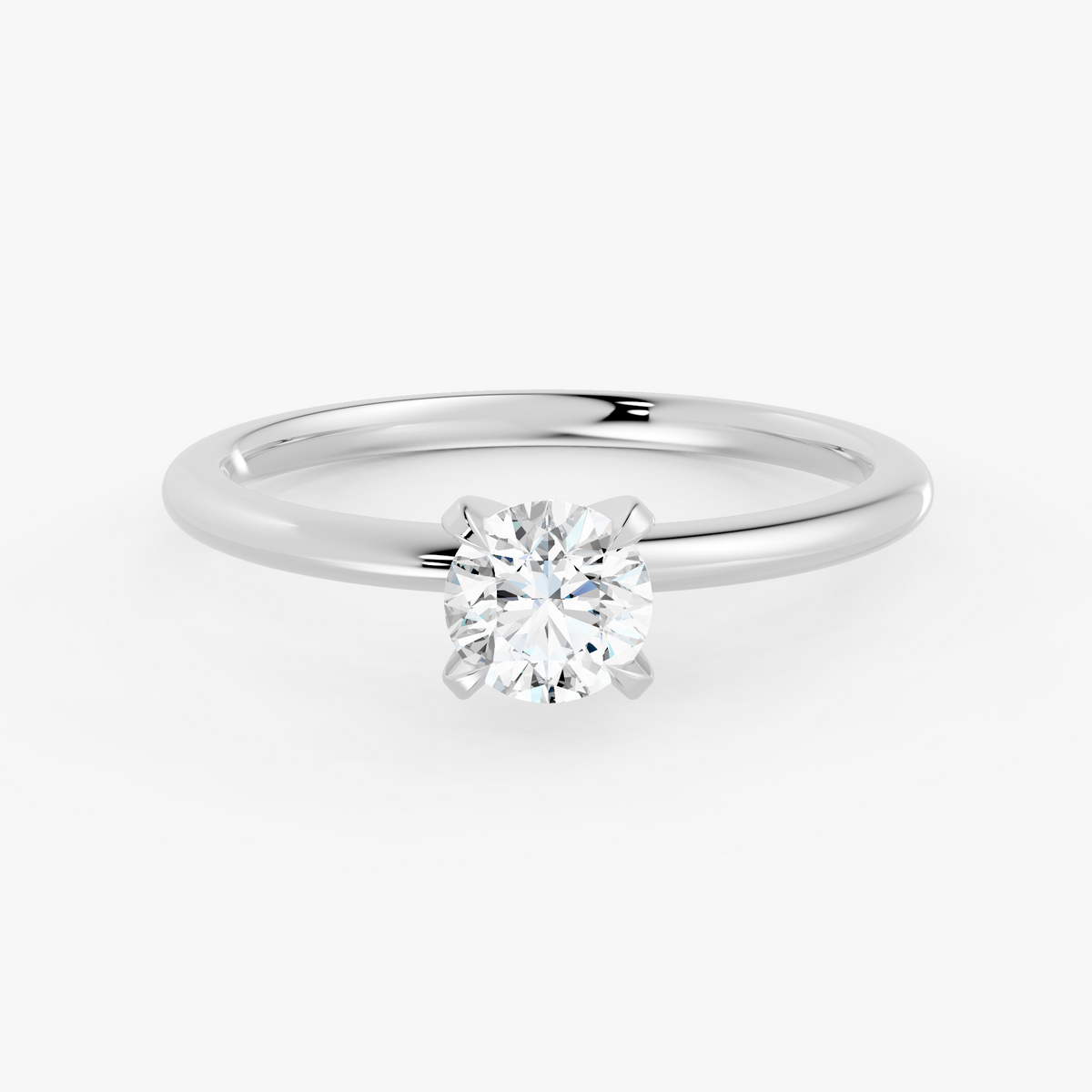 Vivienne solitaire forlovelsesring med rund diamant i hvitt gull, liggende sett forfra